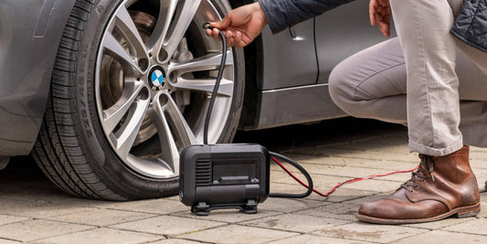 Noco AIR20 - 20A 100PSI Portable Tyre Inflator with 280-watt motor in use inflating a car. Ideal for quick tyre inflation.
