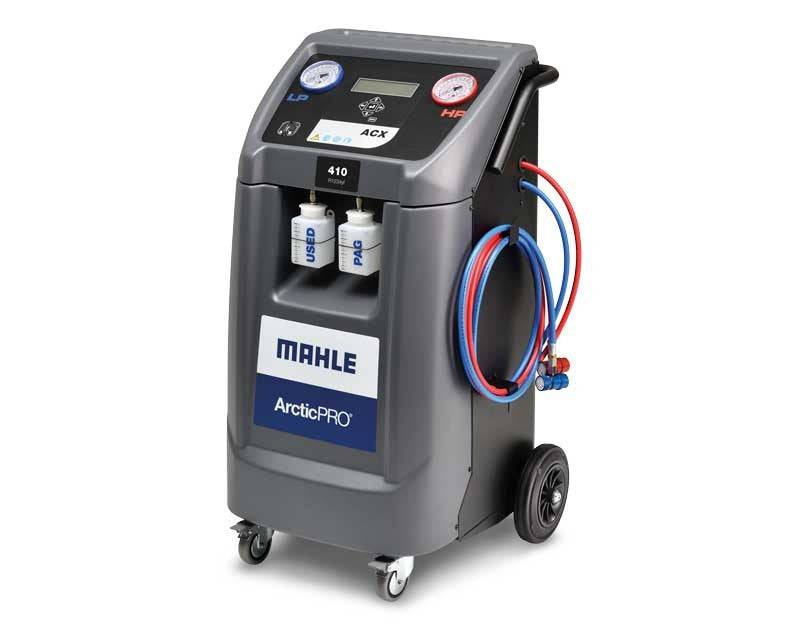 Mahle ArcticPRO ACX310 R134a air-conditioning service machine with dual pressure gauges, service hoses, and fluid containers for workshop use.