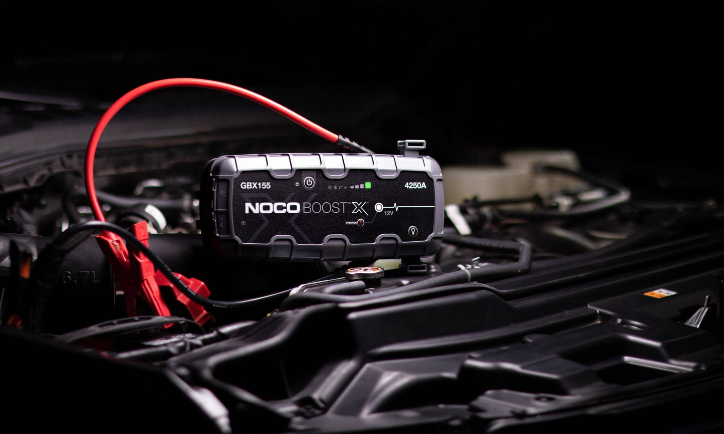 Noco Boost X GBX155 Extreme Power Jump Starter 4250A connected to a car battery, delivering high cranking power for large petrol and diesel engines.
